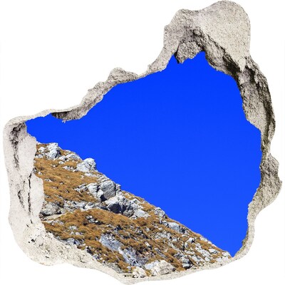 Sticker mural effet trou Paysage de montagne à travers un trou dans le mur