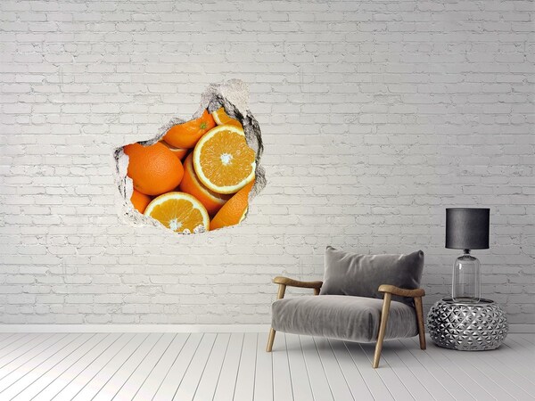 Autocollant à effet 3d trou Des oranges fraîches dans un trou dans le mur