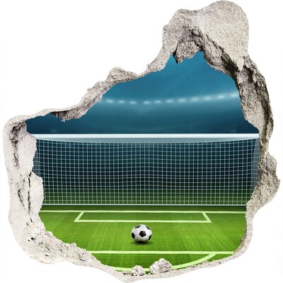 Autocollant mural trou Le stade de football derrière le trou dans le mur