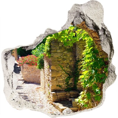 Sticker trou dans le mur Une rue verte dans la ville