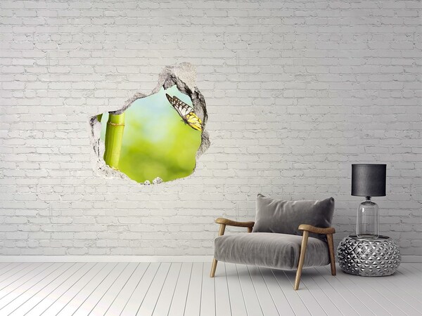 Sticker mural effet trou Papillon dans le jardin de bambous