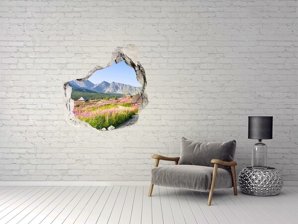 Sticker mural effet trou Une clairière de montagne en fleurs