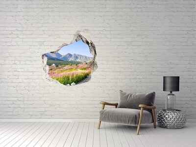 Sticker mural effet trou Une clairière de montagne en fleurs