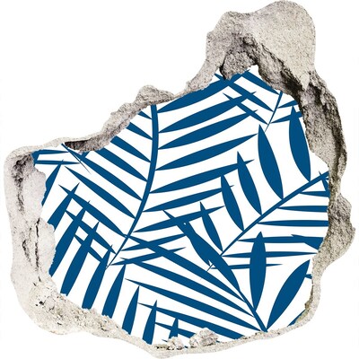 Sticker mural effet trou Des feuilles tropicales dans un trou dans le mur