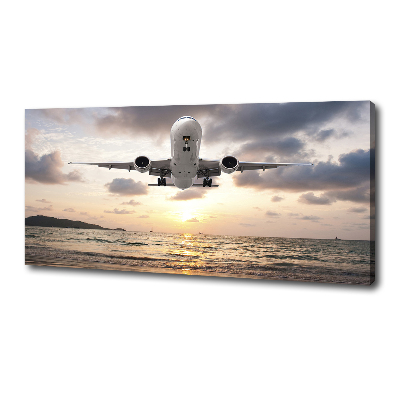 Tableau mural sur toile Avion au-dessus de la mer