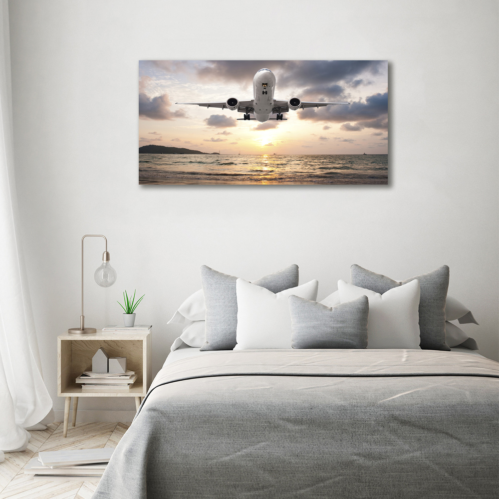 Tableau mural sur toile Avion au-dessus de la mer