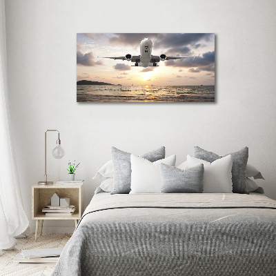 Tableau mural sur toile Avion au-dessus de la mer