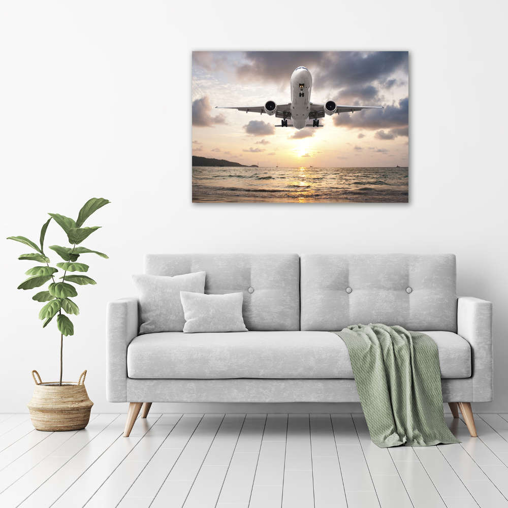 Tableau mural sur toile Avion au-dessus de la mer