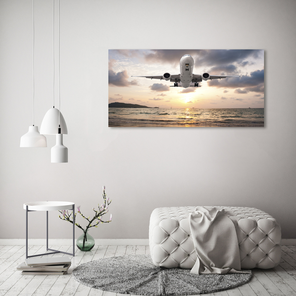 Tableau mural sur toile Avion au-dessus de la mer