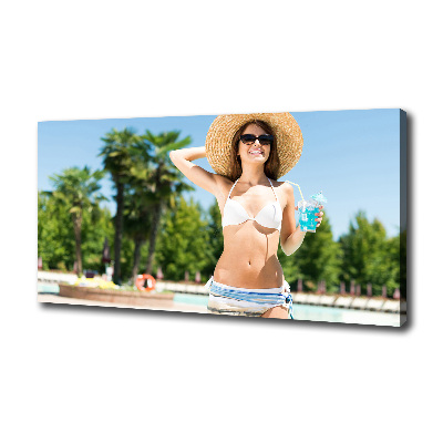 Tableau mural sur toile Femme au bord de la piscine