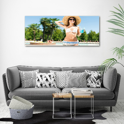 Tableau mural sur toile Femme au bord de la piscine