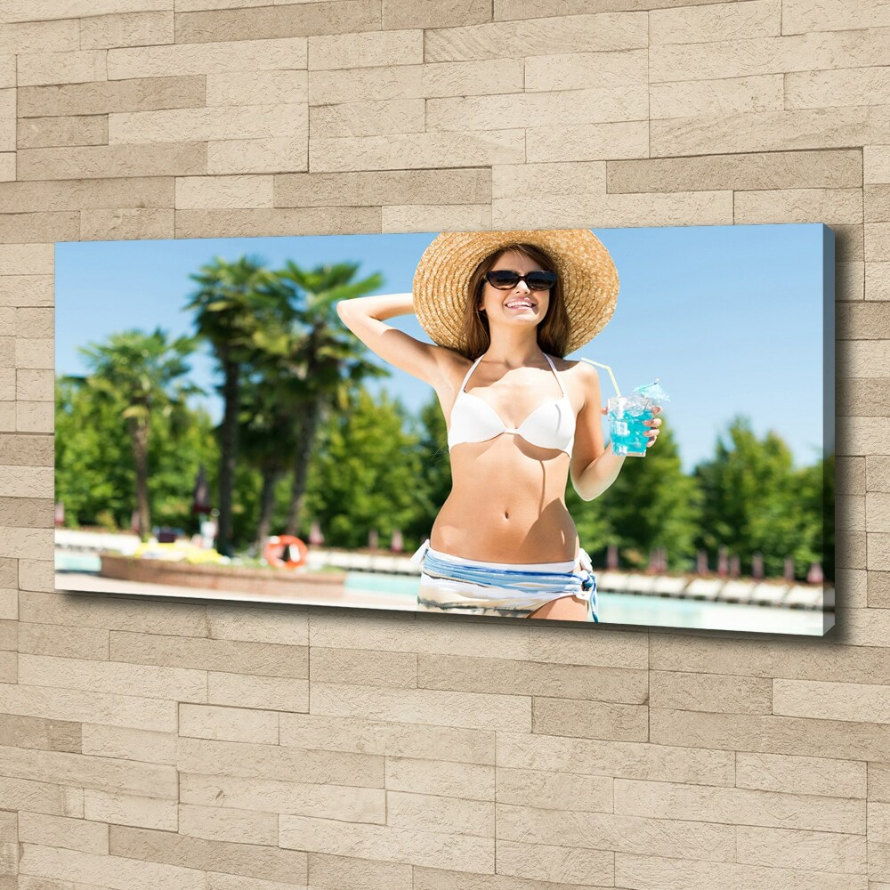 Tableau mural sur toile Femme au bord de la piscine