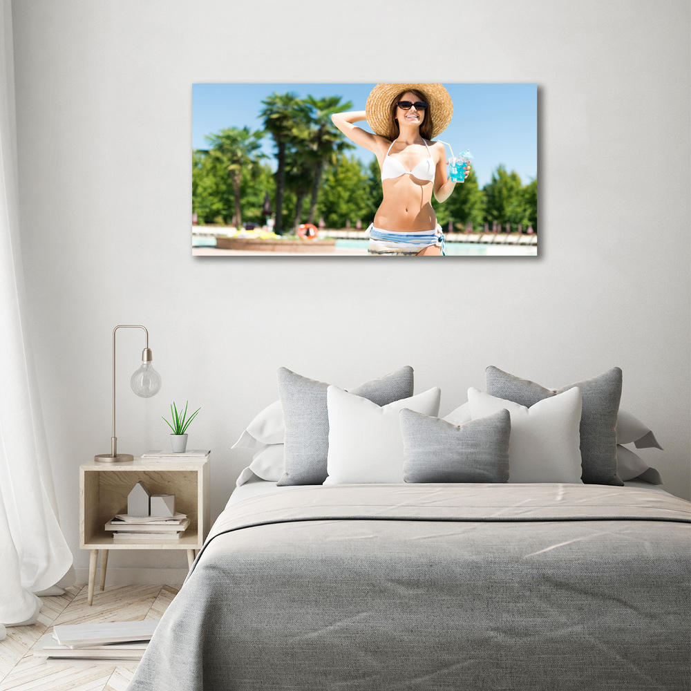 Tableau mural sur toile Femme au bord de la piscine