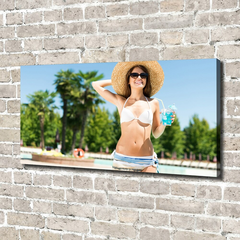 Tableau mural sur toile Femme au bord de la piscine