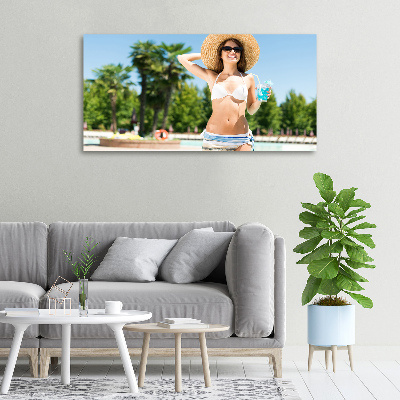 Tableau mural sur toile Femme au bord de la piscine