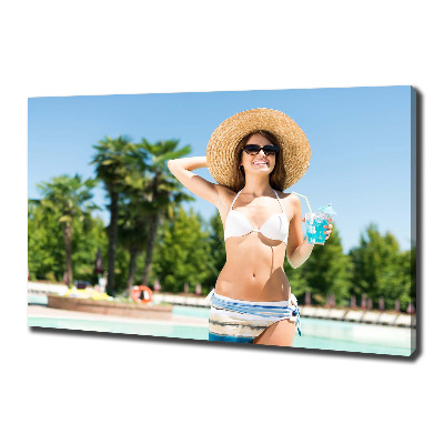 Tableau mural sur toile Femme au bord de la piscine