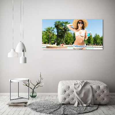 Tableau mural sur toile Femme au bord de la piscine