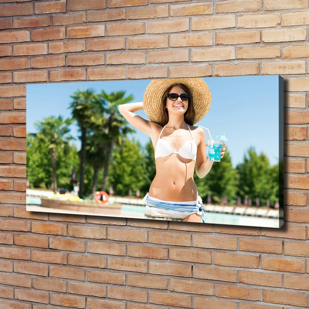 Tableau mural sur toile Femme au bord de la piscine