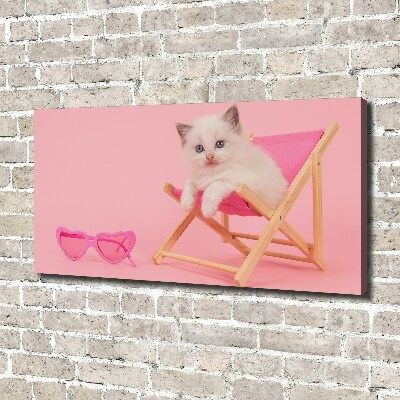 Tableau mural sur toile Chat sur une chaise longue