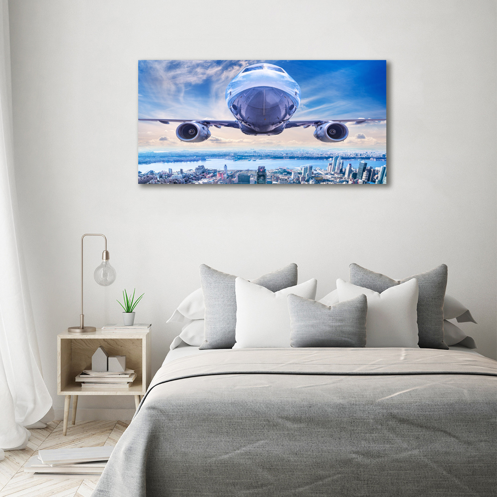 Tableau sur toile Avion au-dessus de la ville