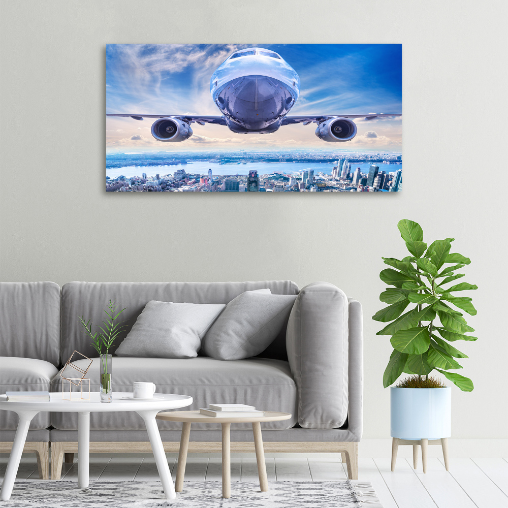 Tableau sur toile Avion au-dessus de la ville