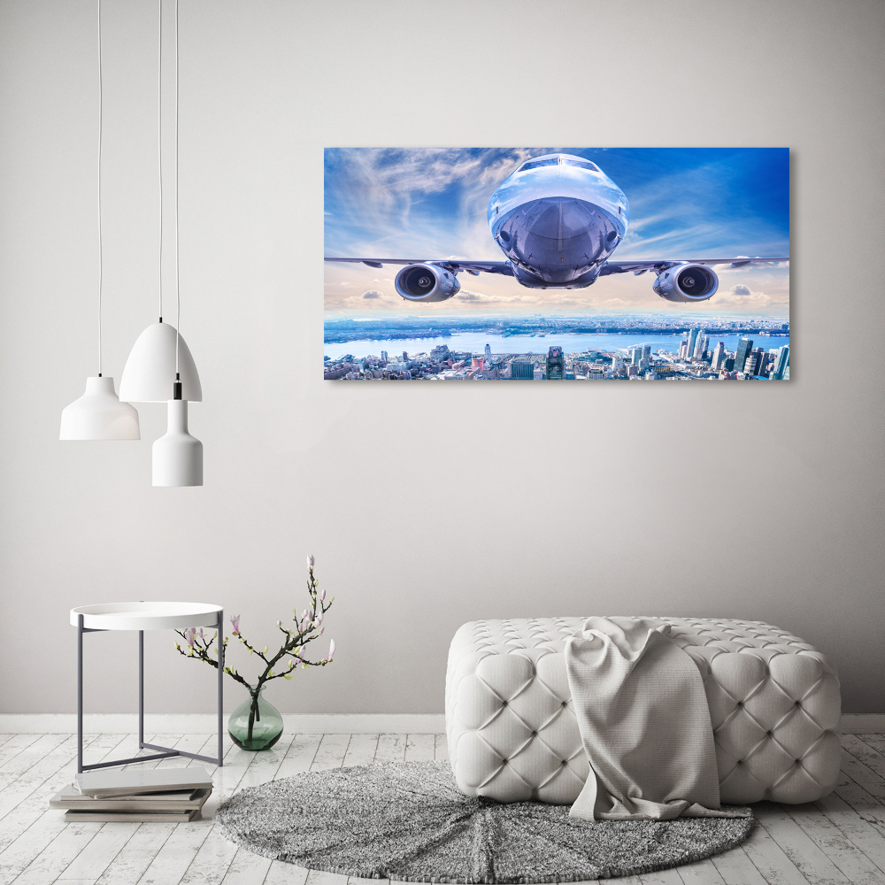 Tableau sur toile Avion au-dessus de la ville