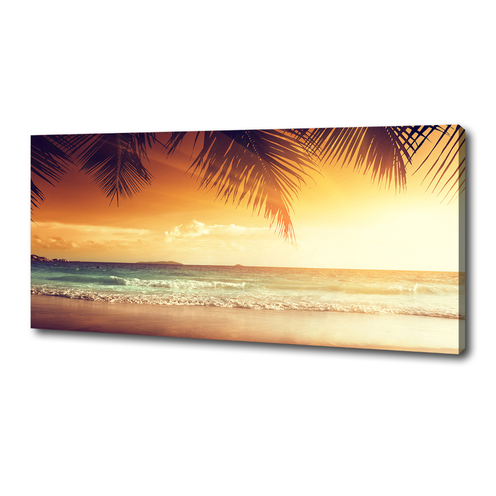 Tableau photo sur toile Plage tropicale feuilles de palmier