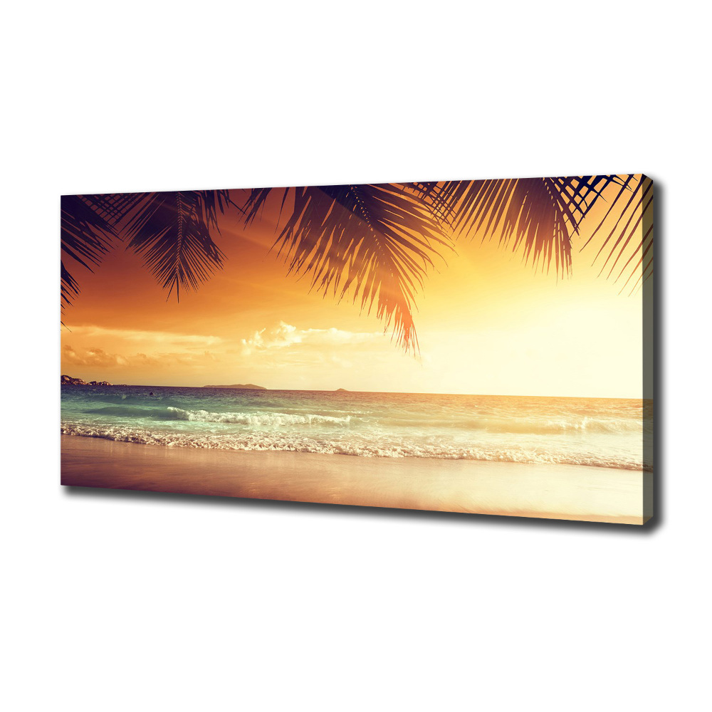 Tableau photo sur toile Plage tropicale feuilles de palmier