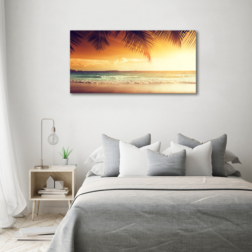 Tableau photo sur toile Plage tropicale feuilles de palmier