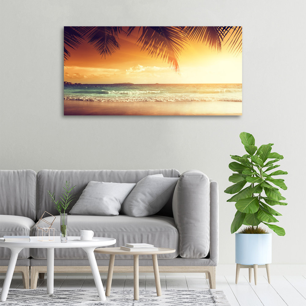 Tableau photo sur toile Plage tropicale feuilles de palmier