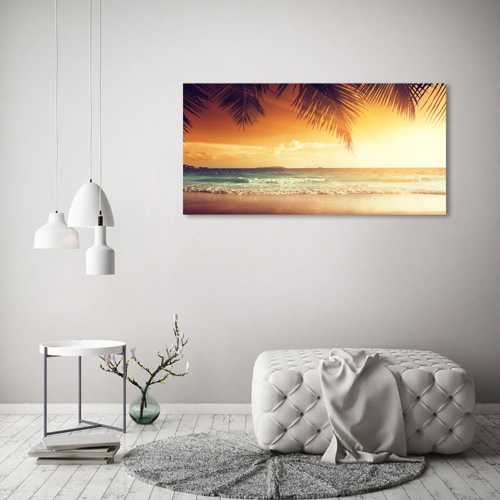 Tableau photo sur toile Plage tropicale feuilles de palmier