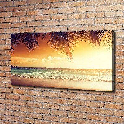 Tableau photo sur toile Plage tropicale feuilles de palmier