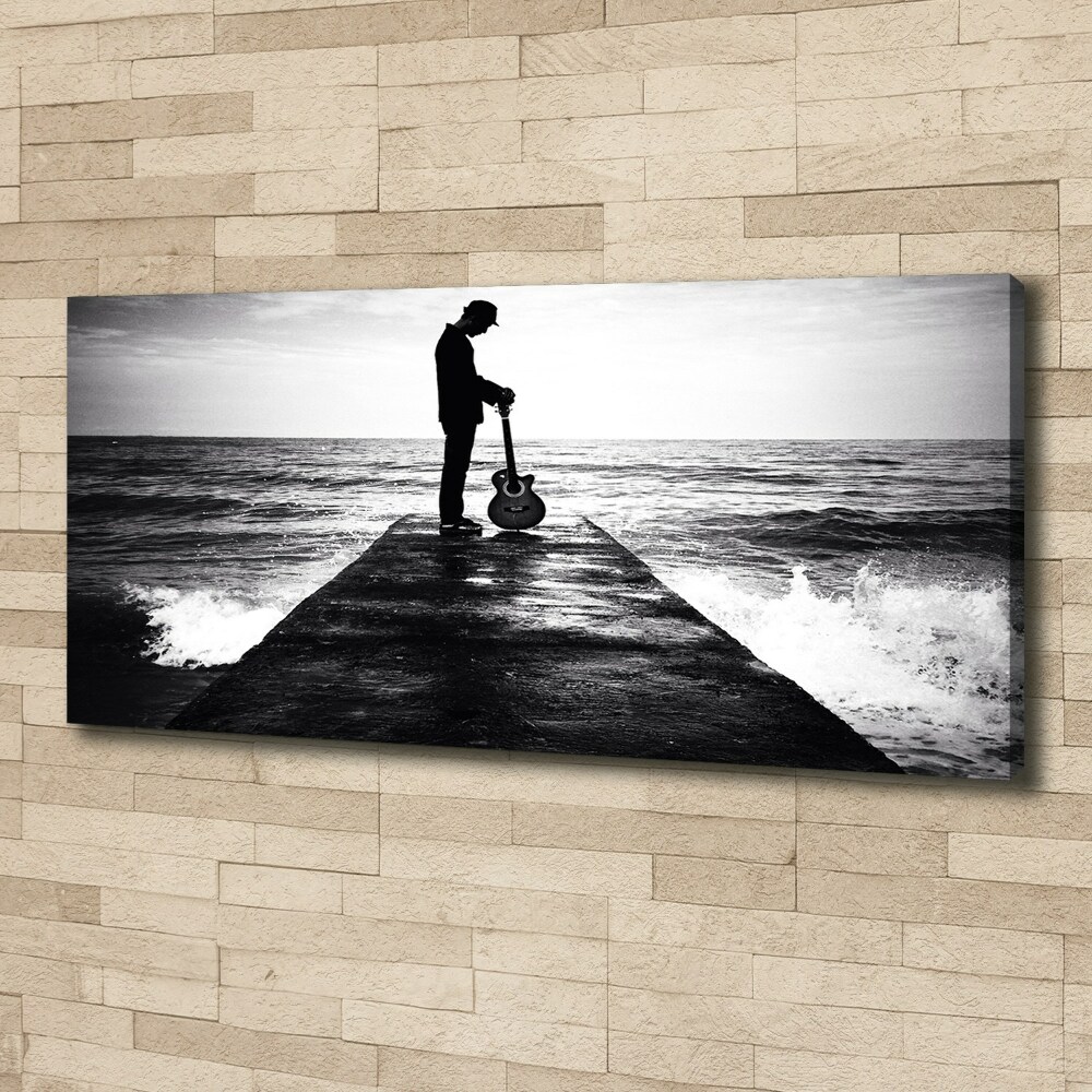 Tableau photo sur toile Guitariste sur une jetée