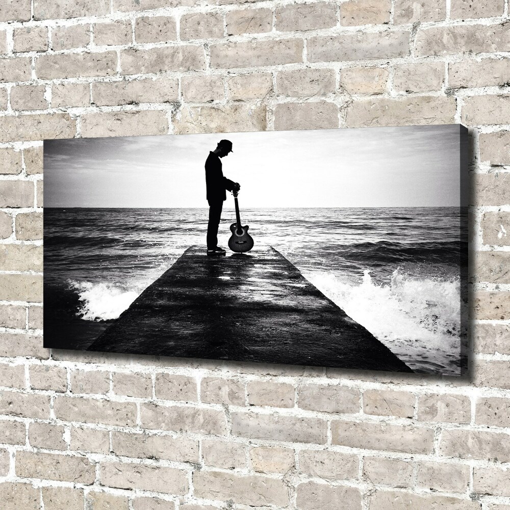 Tableau photo sur toile Guitariste sur une jetée