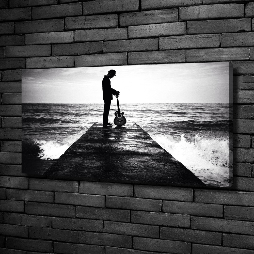 Tableau photo sur toile Guitariste sur une jetée