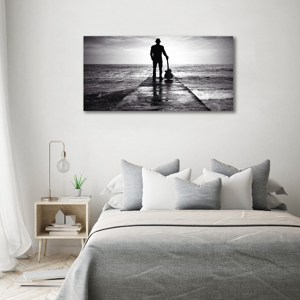 Tableau mural sur toile Guitariste sur une jetée