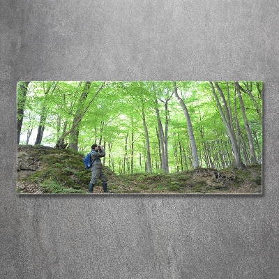 Tableau imprimé sur verre Ornithologue dans la forêt