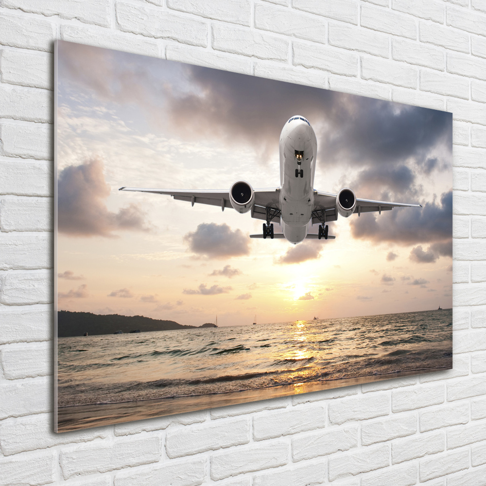 Tableau photo sur verre Avion au-dessus de la mer