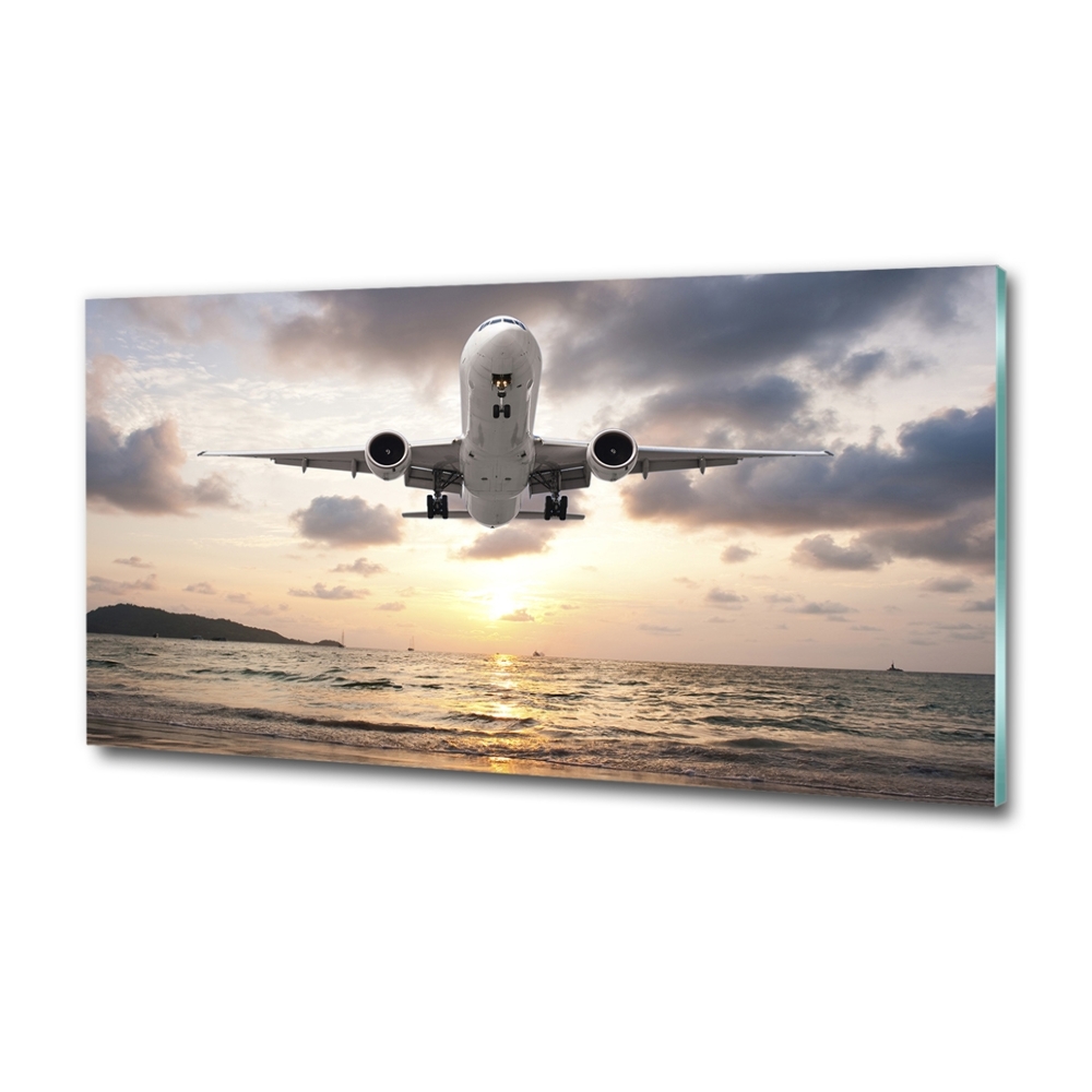 Tableau photo sur verre Avion au-dessus de la mer