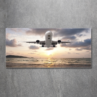 Tableau photo sur verre Avion au-dessus de la mer