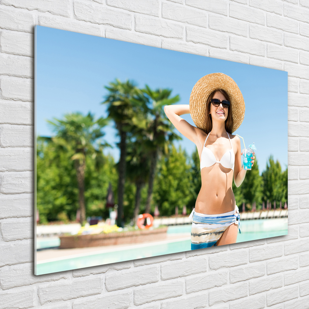 Tableau photo sur verre Femme au bord de la piscine