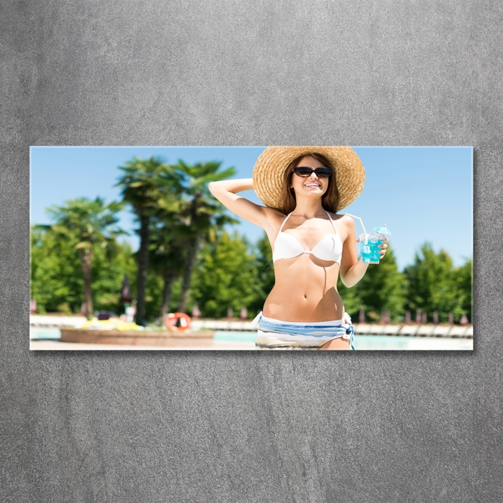 Tableau photo sur verre Femme au bord de la piscine