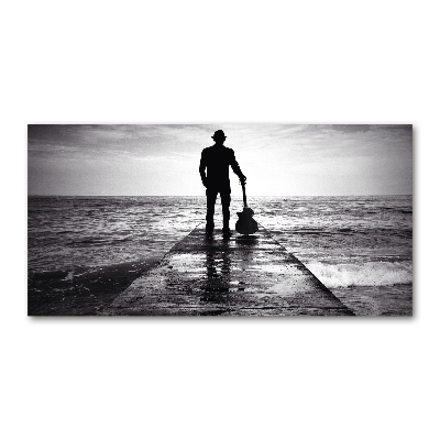 Tableau photo sur verre Guitariste sur une jetée