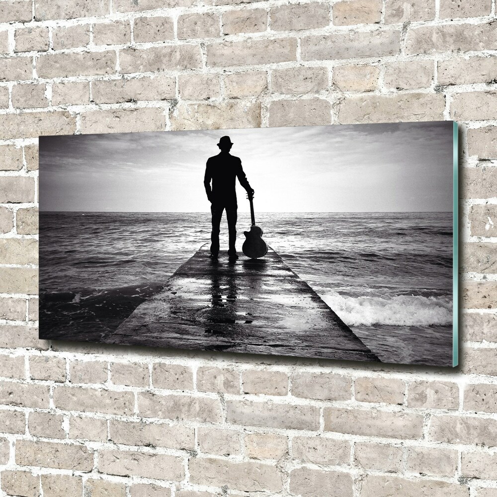 Tableau photo sur verre Guitariste sur une jetée