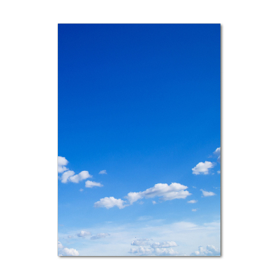 Tableau imprimé sur verre Nuages dans le ciel bleu