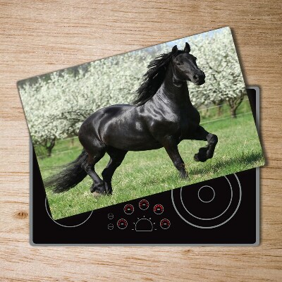 Protection plaque induction Cheval noir fleurissant les arbres