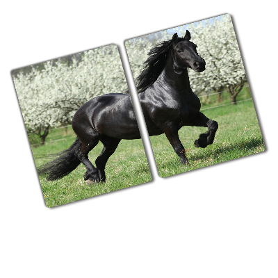 Protection plaque induction Cheval noir fleurissant les arbres