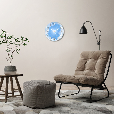 Horloge ronde murale Des nuages dans le ciel un rayon de soleil