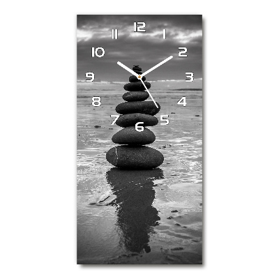 Horloge verticale en verre Pierres sur la plage