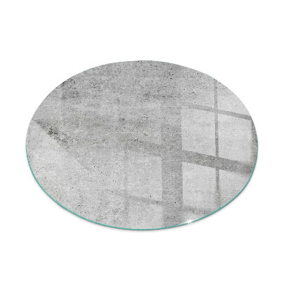 Plaque de sol ronde en verre cheminée motif en béton brut